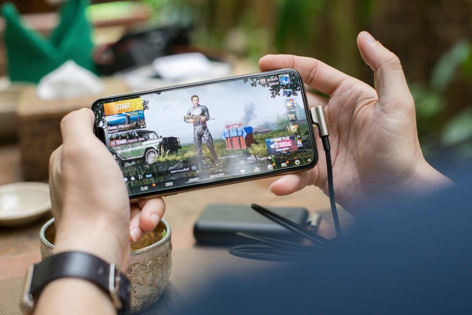 Mobile gamer competing in intense esports match on smartphone